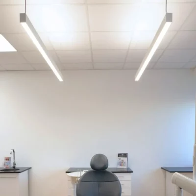 Renovated M+W Dental showroom in Büdingen featuring A-dec dental chairs illuminated by Dentled full-spectrum daylight LED panels and luminaires.
