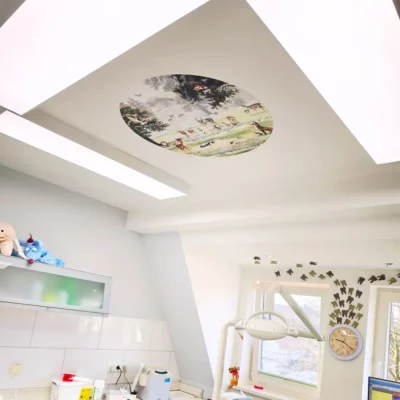 DL120 full spectrum daylight LED panels installed in three treatment rooms at Zahnarztpraxis Wendland by Dr. Christina Berger, featuring 5000K natural working light and calming ceiling visuals above the dental chair.