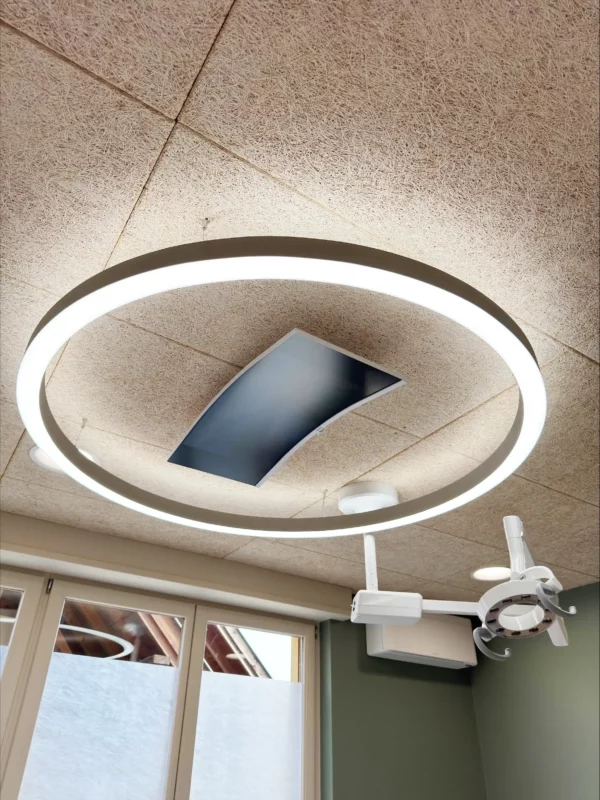 High-performance Dentled PVR150 ring light installed above dental chair delivering even 5000K daylight lighting for dentists.