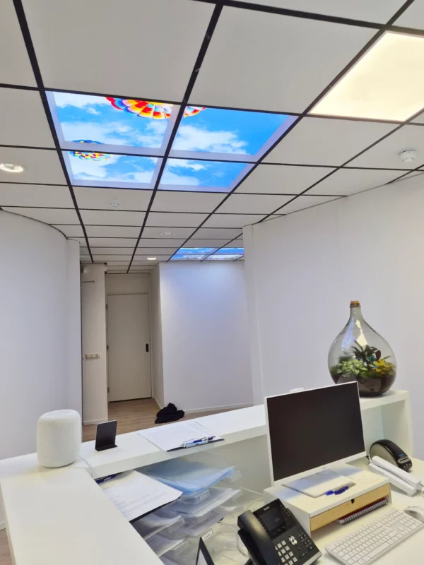 Modern dental clinic interior at OraMax Clinics Breda featuring Dentled photo ceiling panels.