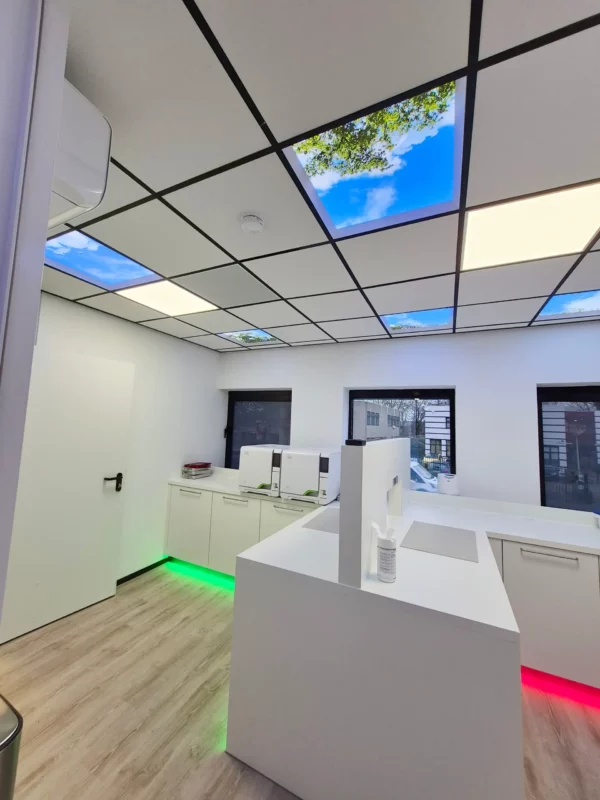 Contemporary dental clinic design with Dentled photo ceiling panels at OraMax Clinics Breda.