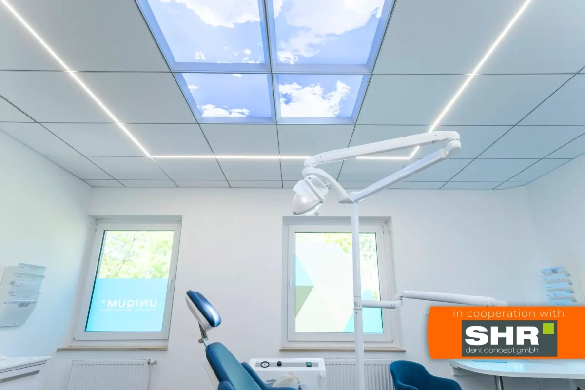 Modern dental clinic interior with Dentled photo ceiling panels creating a calm treatment environment.