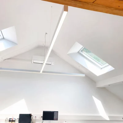 Custom DentLed T-shaped full-spectrum daylight luminaire installed in the dental laboratory at Zahnzentrum Viersen, Germany.