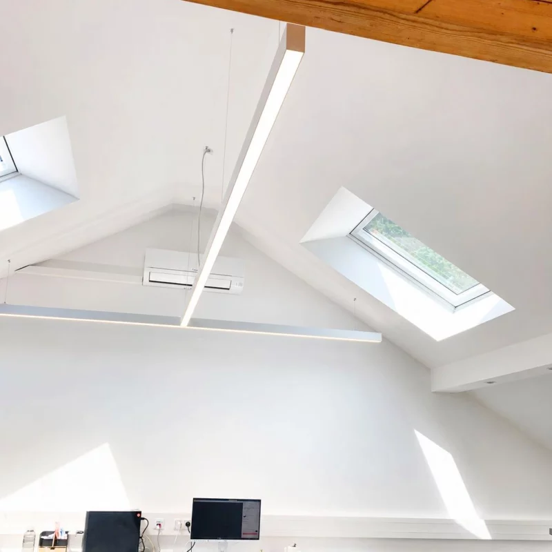 Custom DentLed T-shaped full-spectrum daylight luminaire installed in the dental laboratory at Zahnzentrum Viersen, Germany.