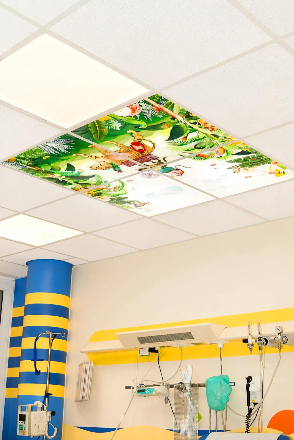 Nature-inspired LED ceiling photo panels creating a welcoming atmosphere in a pediatric hospital.