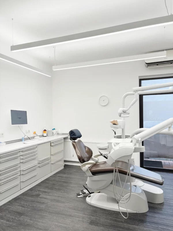 Four DentLED PHL22 bidirectional luminaires providing daylight spectrum lighting in a large dental treatment room